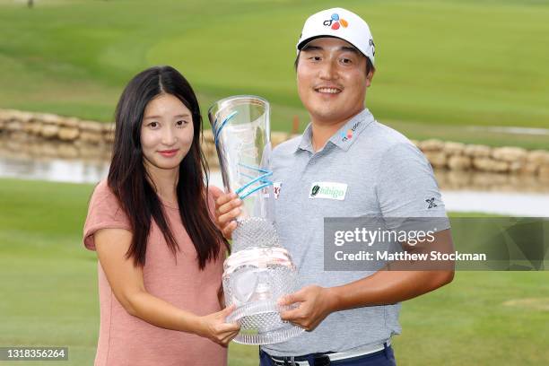 Lee of South Korea and his wife celebrate with the trophy after winning the AT&T Byron Nelson at TPC Craig Ranch on May 16, 2021 in McKinney, Texas....