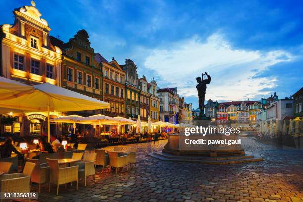 old market square during sunset in poznan poland - breslau stock pictures, royalty-free photos & images