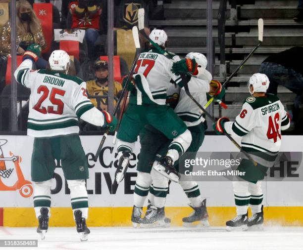 Jonas Brodin, Marcus Foligno, Joel Eriksson Ek, Jordan Greenway and Jared Spurgeon of the Minnesota Wild celebrate after Eriksson Ek scored an...