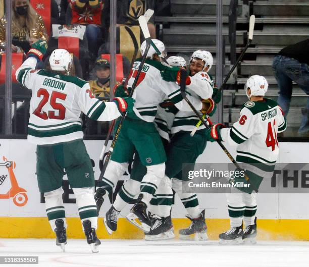 Jonas Brodin, Marcus Foligno, Joel Eriksson Ek, Jordan Greenway and Jared Spurgeon of the Minnesota Wild celebrate after Eriksson Ek scored an...