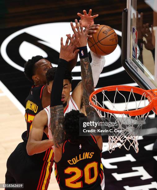 Kenyon Martin Jr. #6 of the Houston Rockets has his shot blocked by Onyeka Okongwu and John Collins of the Atlanta Hawks during the first half at...