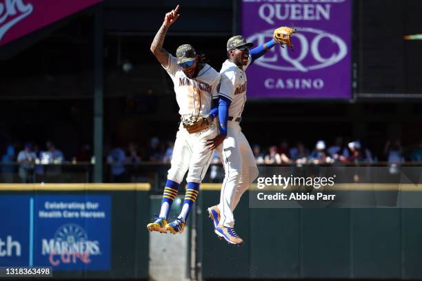 Crawford and Kyle Lewis of the Seattle Mariners celebrate the 3-2 win against the Cleveland Indians at T-Mobile Park on May 16, 2021 in Seattle,...