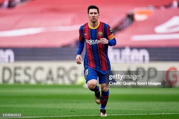 Lionel Messi of FC Barcelona looks on during the La Liga Santander match between FC Barcelona and RC Celta at Camp Nou on May 16, 2021 in Barcelona,...