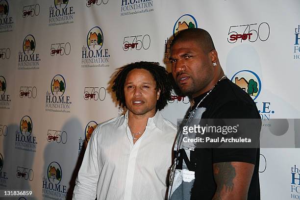 Athletes Cobi Jones and Quinton "Rampage" Jackson arrive at the H.O.M.E. Foundation's STIKS celebrity video game challenge at Spot 5750 on January...