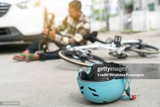 accident car crash with bicycle on road - gewonde stockfoto's en -beelden