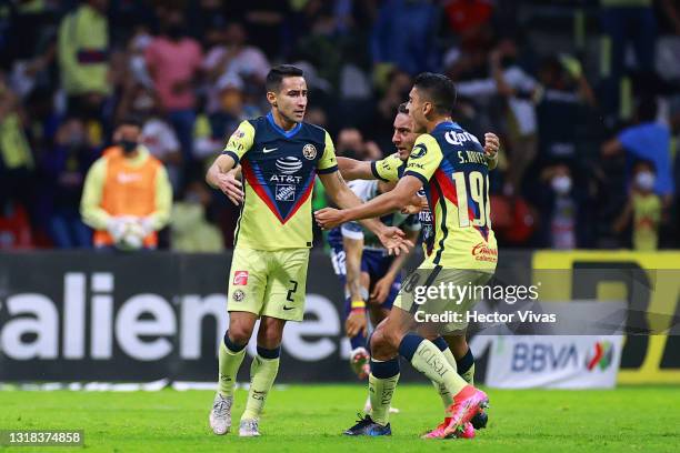 Luis Fuentes of America celebrates with teammates after scoring the second goal of his team during the quarterfinals second leg match between America...