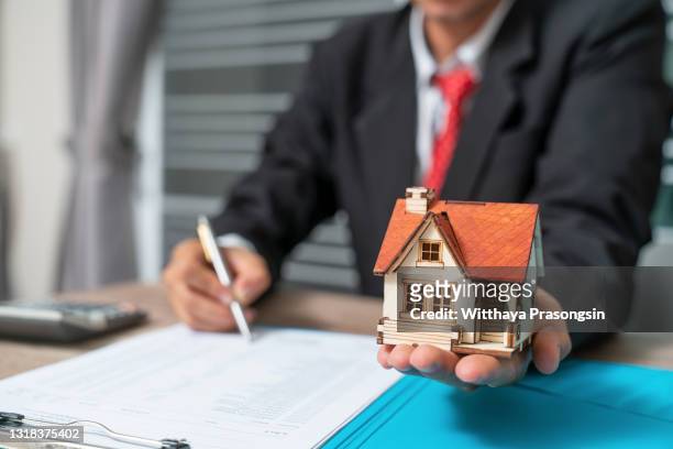 business with customer after contract signature of buying house - home loan interest rate stock pictures, royalty-free photos & images