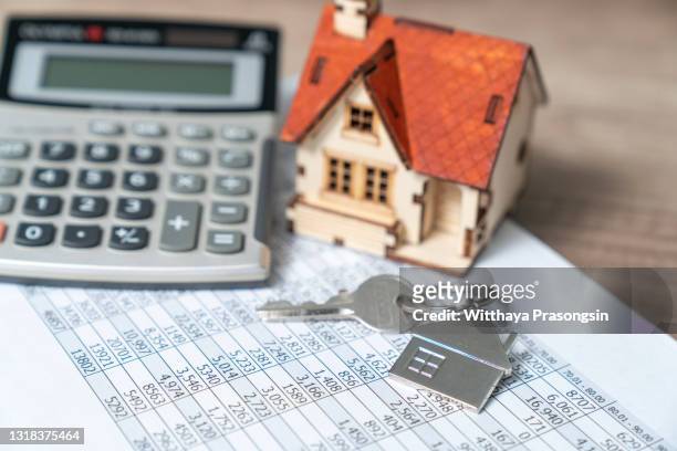bank calculates the home loan rate - home loans stock pictures, royalty-free photos & images