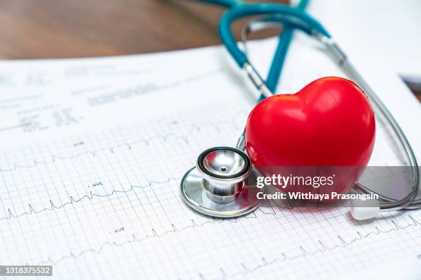 stethoscope and red heart heart check.concept healthcare. - stethoscope heart stock-fotos und bilder