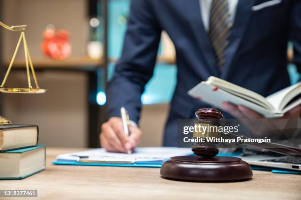 close up lawyer businessman working or reading lawbook in office workplace for consultant lawyer concept - 立法 ストックフォトと画像