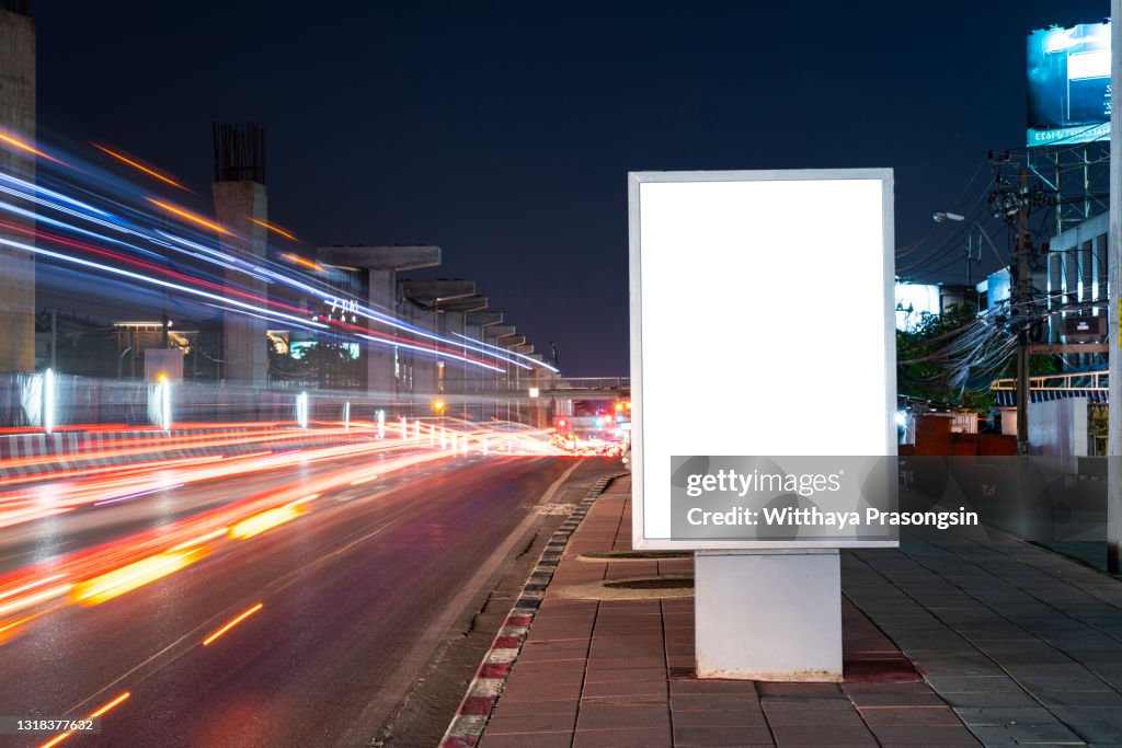 White Blank billboard on light trails night street