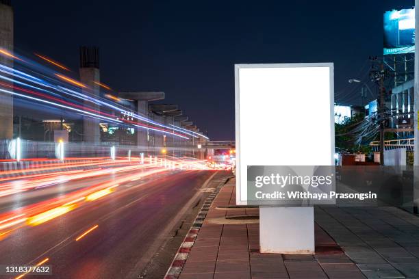 white blank billboard on light trails night street - advertising sign stock pictures, royalty-free photos & images