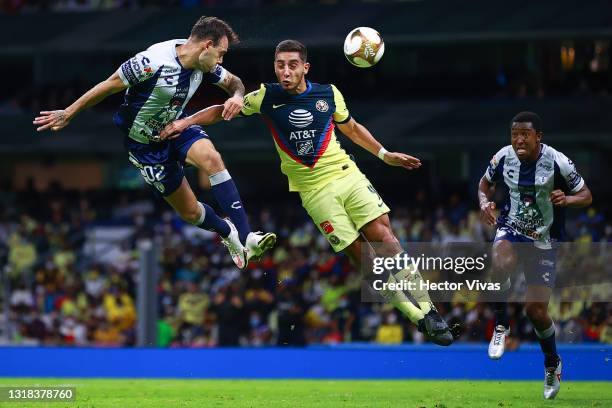 Matias Catalan of Pachuca struggles for the ball against Sebastian Caceres of America during the quarterfinals second leg match between America and...