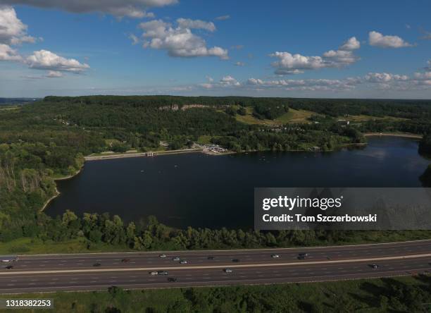 An aerial view of Kelso Lake with Highway 401 in the foreground and the limestone cliffs in the Kelso Conservation Area at Glen Eden on the Niagara...