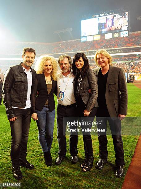 Phillip Sweet, Kimberly Schlapman, Karen Fairchild and Jimi Westbrook of Little Big Town pose with ACT President Bruce Orosz after perform the...
