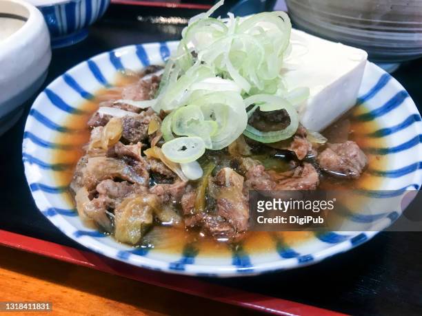 braised beef tendon with tofu and long onions - tendon stock pictures, royalty-free photos & images
