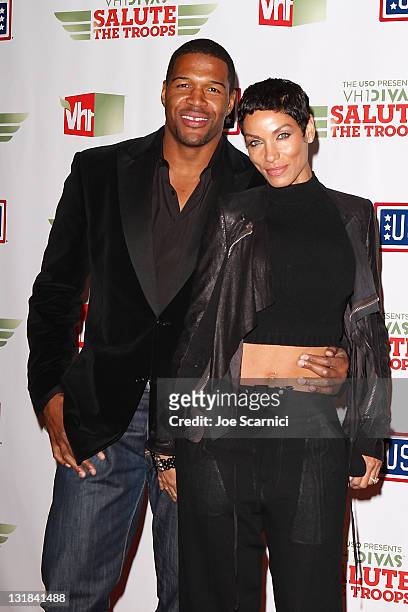 Michael Strahan poses with his wife Nicole Murphy at The USO Presents "VH1 Divas Salute The Troops" at Marine Corps Air Station Miramar on December...
