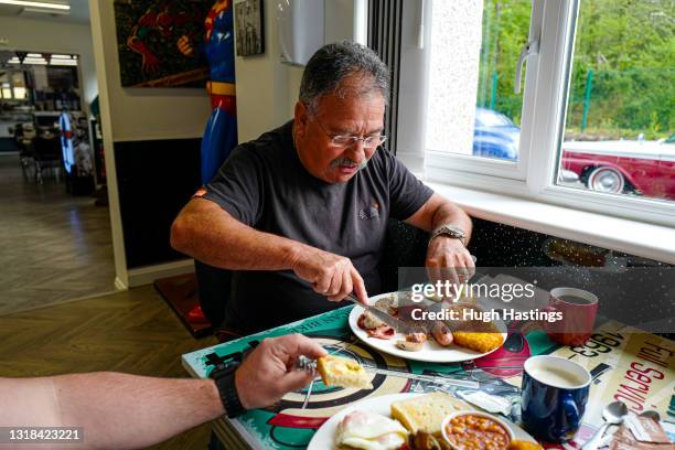 Customer is served a full English Breakfast at an indoor table at Jenn's Diner, Redruth, on May 17, 2021 in Falmouth, England. England implements the...