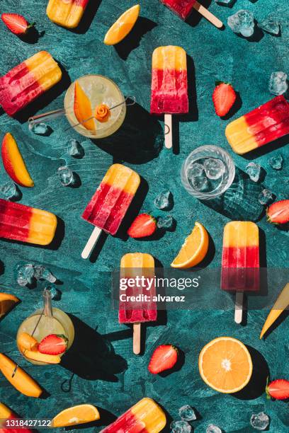 homemade fruit ice lollies and juice - cold temperature color stock pictures, royalty-free photos & images