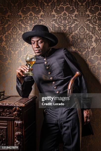 african traditionally dressed european man with a weapon - 17th century man stock pictures, royalty-free photos & images