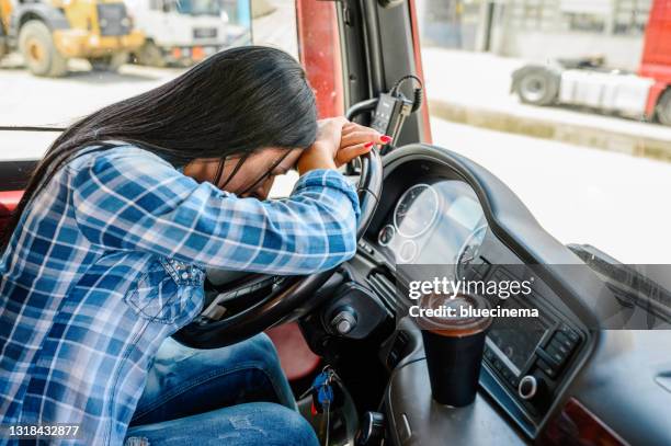 female truck driver sleeping. - tired driver stock pictures, royalty-free photos & images