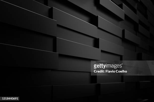 wall of shiny black displaced bricks - 3d pattern black and white stockfoto's en -beelden