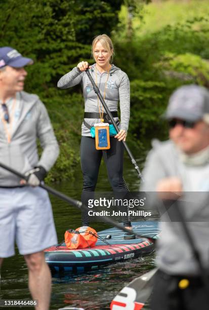 Chloe Madeley during "The Big Stand Up" paddle boarding charity event at Basingstoke Canal on May 17, 2021 in Basingstoke, England. A team of 11 are...