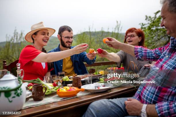 the family enjoys an easter lunch - easter dinner stock pictures, royalty-free photos & images