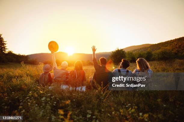 hikers waving at the sun - friends waving stock pictures, royalty-free photos & images