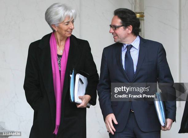 France's Finance and Economy Minister Christine Lagarde and France's Transport Junior Minister Frederic Lefebvre leave the weekly cabinet meeting at...