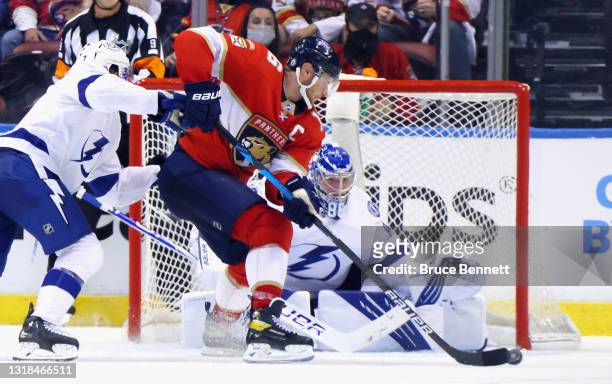 Andrei Vasilevskiy of the Tampa Bay Lightning defends against Aleksander Barkov of the Florida Panthers in Game One of the First Round of the 2021...