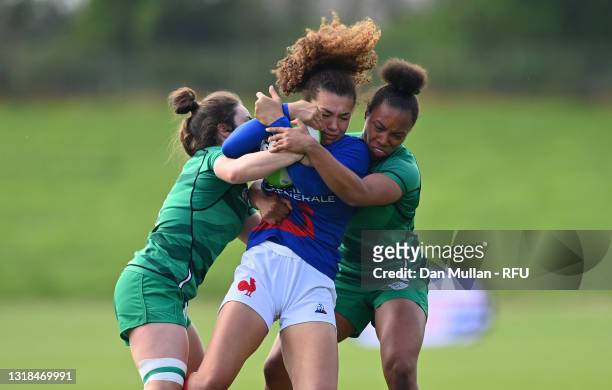 Caroline Drouin of France is tackled by Katie Heffernan and Grace Moore of Ireland during the match between Ireland Women and France Women on day...
