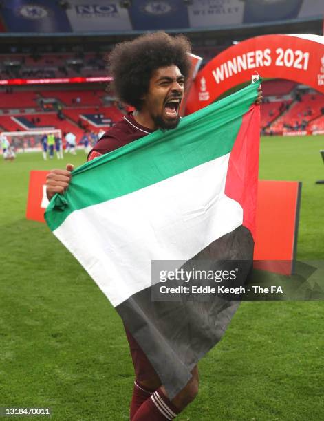 Hamza Choudhury of Leicester City celebrates while holding up a Palestine national flag following victory in The Emirates FA Cup Final match between...