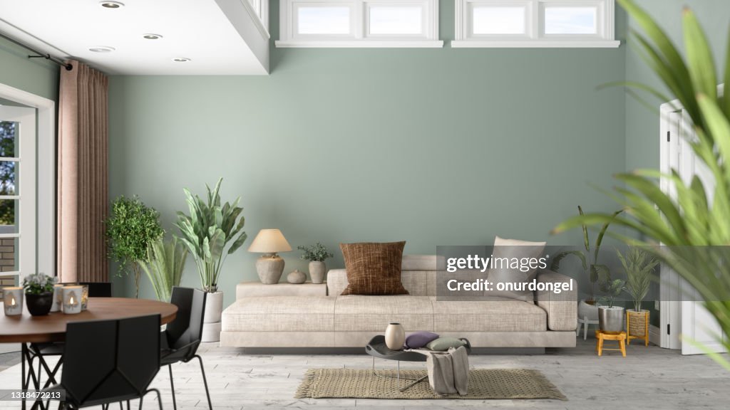 Intérieur moderne de salle de vie avec des usines vertes, le sofa et le fond vert de mur