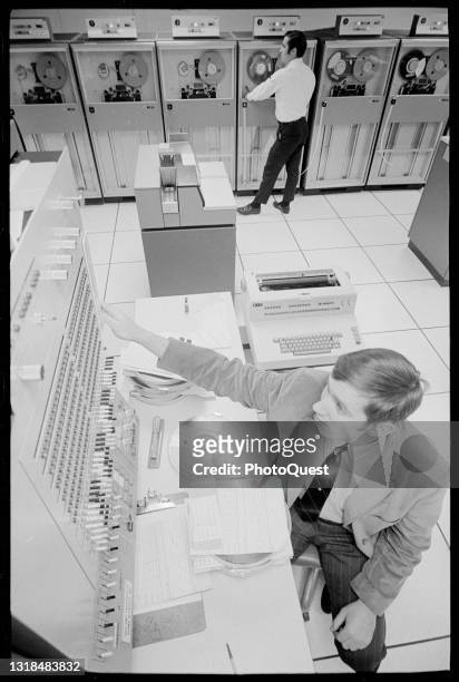 Elevated view of computer operators as they work at the American Express financial services corporation, New York, New York, November 3, 1969.