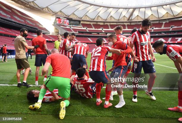 Joao Felix of Atletico de Madrid celebrates with Stefan Savic, Renan Lodi, Kieran Trippier and Felipe after their team mate Luis Suarez scores their...