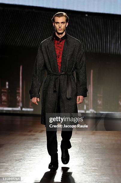 Model walks the runway during the Ermenegildo Zegna show during Milan Fashion Week Menswear Autumn/Winter 2011 on January 15, 2011 in Milan, Italy.