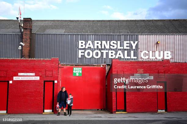 Two Barnsley fans wait outside the stadium prior to the Sky Bet Championship Play-off Semi Final 1st Leg match between Barnsley and Swansea City at...