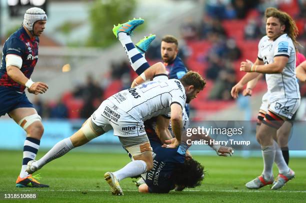 Steven Luatua of Bristol Bears is tackled by Ed Slater and Matias Alemanno of Gloucester Rugby leading to a red card for Matias Alemanno of...