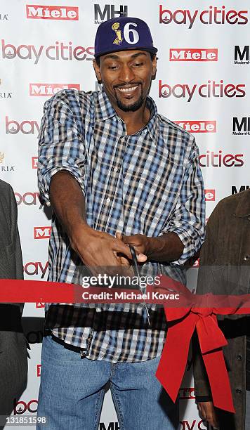 Lakers basketball player Ron Artest cuts the ribbon at the Bay Cities Kitchens Grand Opening at Bay Cities Kitchens and Appliances on November 22,...