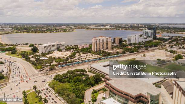 aerial drone footage of downtown west palm beach, florida from okeechobee blvd. & parker ave. in may of 2021 - west palm beach stock pictures, royalty-free photos & images