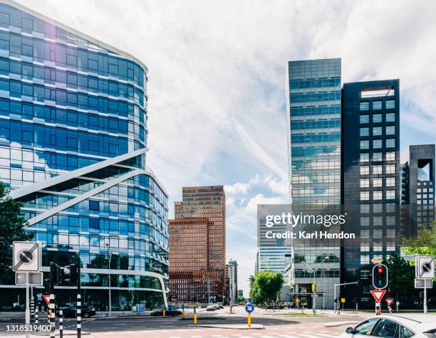 a surface level daytime view of amsterdam's business district - stock photo - amsterdam business stock pictures, royalty-free photos & images