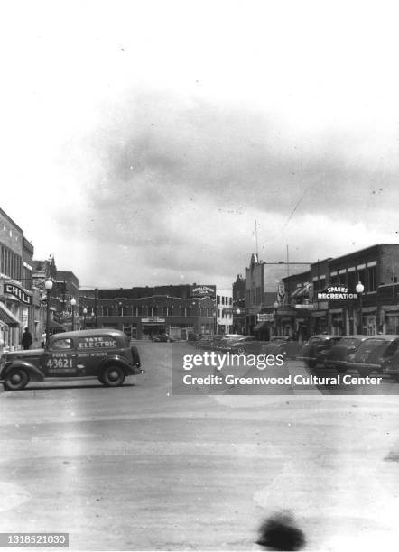 View of along Greenwood Avenue, Tulsa, Oklahoma, 1930s. Among the visible businesses are the offices of the Oklahoma Eagle newspaper .