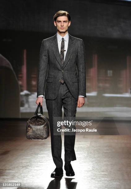 Model walks the runway during the Ermenegildo Zegna show during Milan Fashion Week Menswear Autumn/Winter 2011 on January 15, 2011 in Milan, Italy.