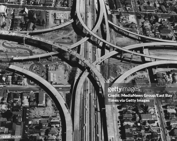 Construction of the Grove-Shafter Freeway and Bay Area Rapid Transit lines is underway in this aerial photo from about October 1968 where they...