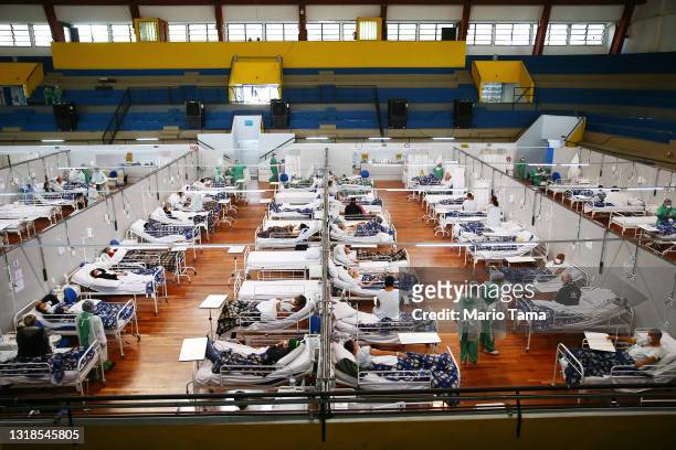 Health care workers care for COVID-19 patients at a field hospital set up in the Pedro Dell’Antonia Sports Complex on May 17, 2021 in Santo Andre,...