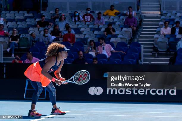 Naomi Osaka of Japan prepares to return serve in her third round match against Ons Jabeur of Tunisia during day five of the 2021 Australian Open at...