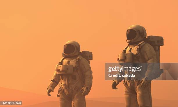 astronauts exploring mars - space man on mars imagens e fotografias de stock