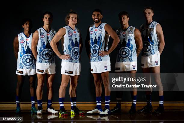 Phoenix Spicer, Jy Simpkin, Jed Anderson, Tarryn Thomas, Kyron Hayden and Matt McGuinness pose during a portrait session in the North Melbourne...