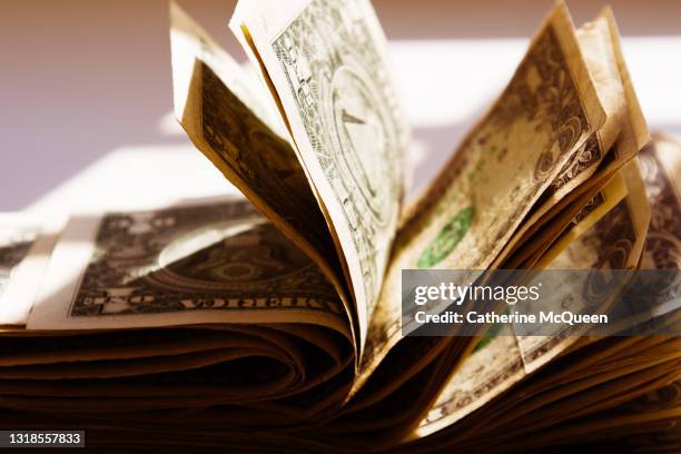 wad of u.s. paper bills - us paper currency stock pictures, royalty-free photos & images